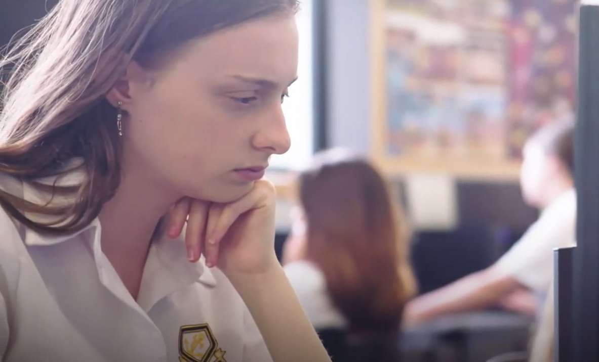 A student is sitting in front of a computer