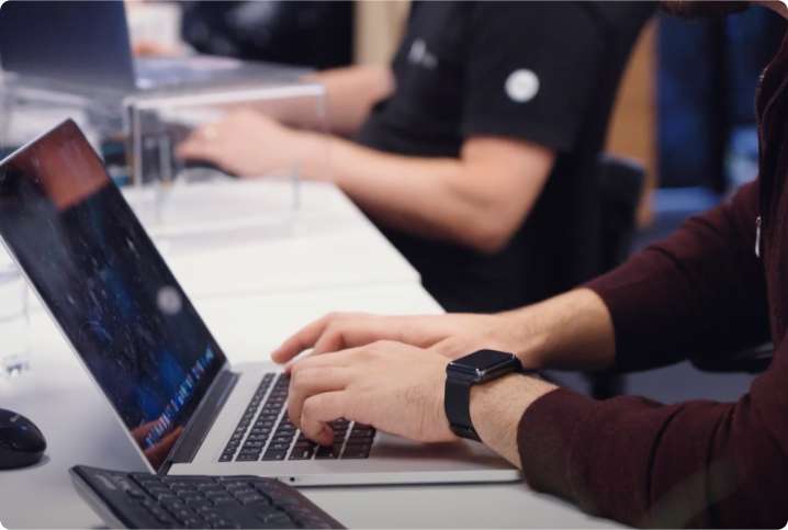 A person typing on a laptop