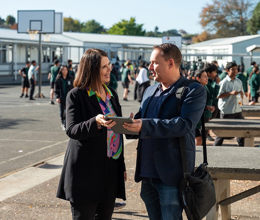 A person pointing at a laptop